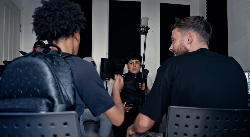 Young creatives gathered in a studio circle