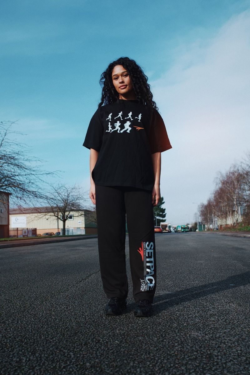 Set Pace community merchandise — model wearing the collection